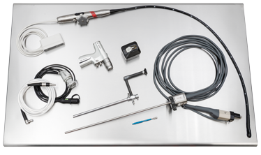Assorted medical endoscopy equipment and components on a stainless steel surface