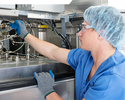 technician using a washer/disinfector