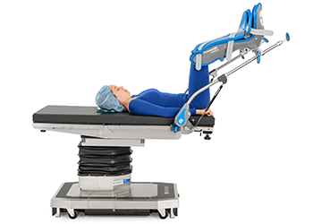Patient lying on a surgical table with leg supports