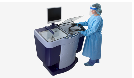 technician using endoscope reprocessor