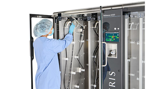 Technician with Endoscope Drying Cabinet
