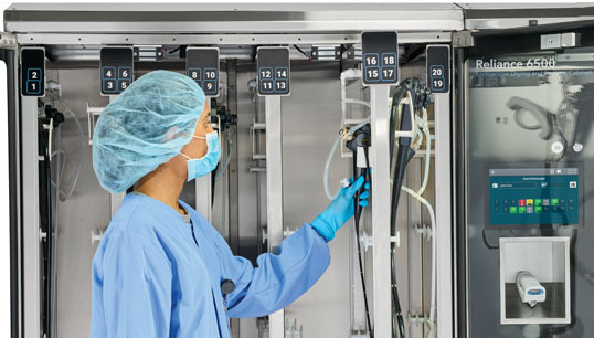 Technician Hanging Endoscope in Drying Cabinet