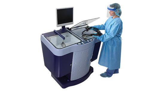 Technician using Automatic Endoscope Reprocessor