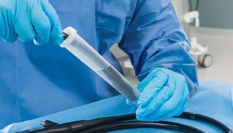 Large medical device being pre-cleaned with PRE-KLENZ Soak Shield
