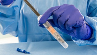 Pre-cleaning of a medical device with PRE-KLENZ Soak Shield.