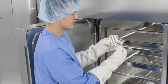 Man placing Verify Bowie-Dick Test Card in sterilizer