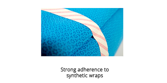 Strong adherence to synthetic wraps