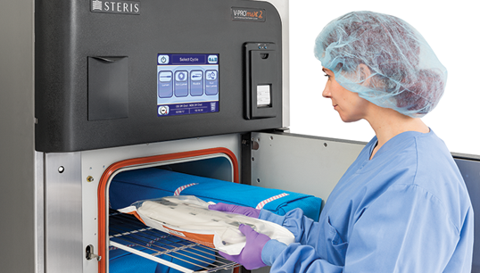 Loading Vis-U-All Low Temperature Sterilization pouch in sterilizer