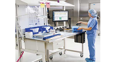 doctor using the facilities monitor on a table