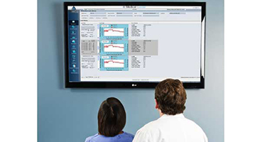 two surgeons with display monitor 
