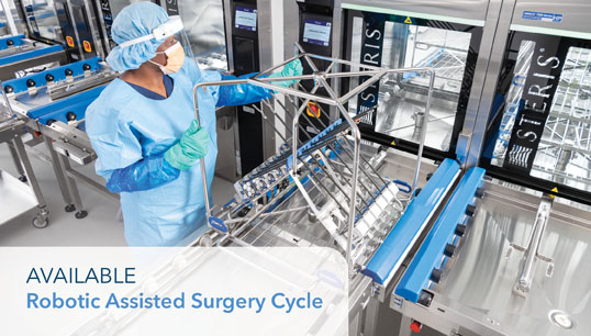 Technician loading robotics into Washer/Disinfector