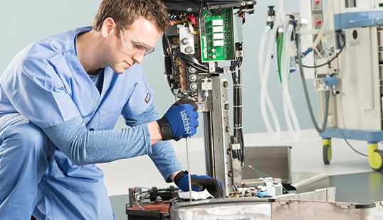 STERIS Technician working to conduct equipment repair.