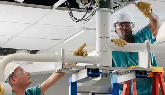 STERIS Technicians working to install equipment.